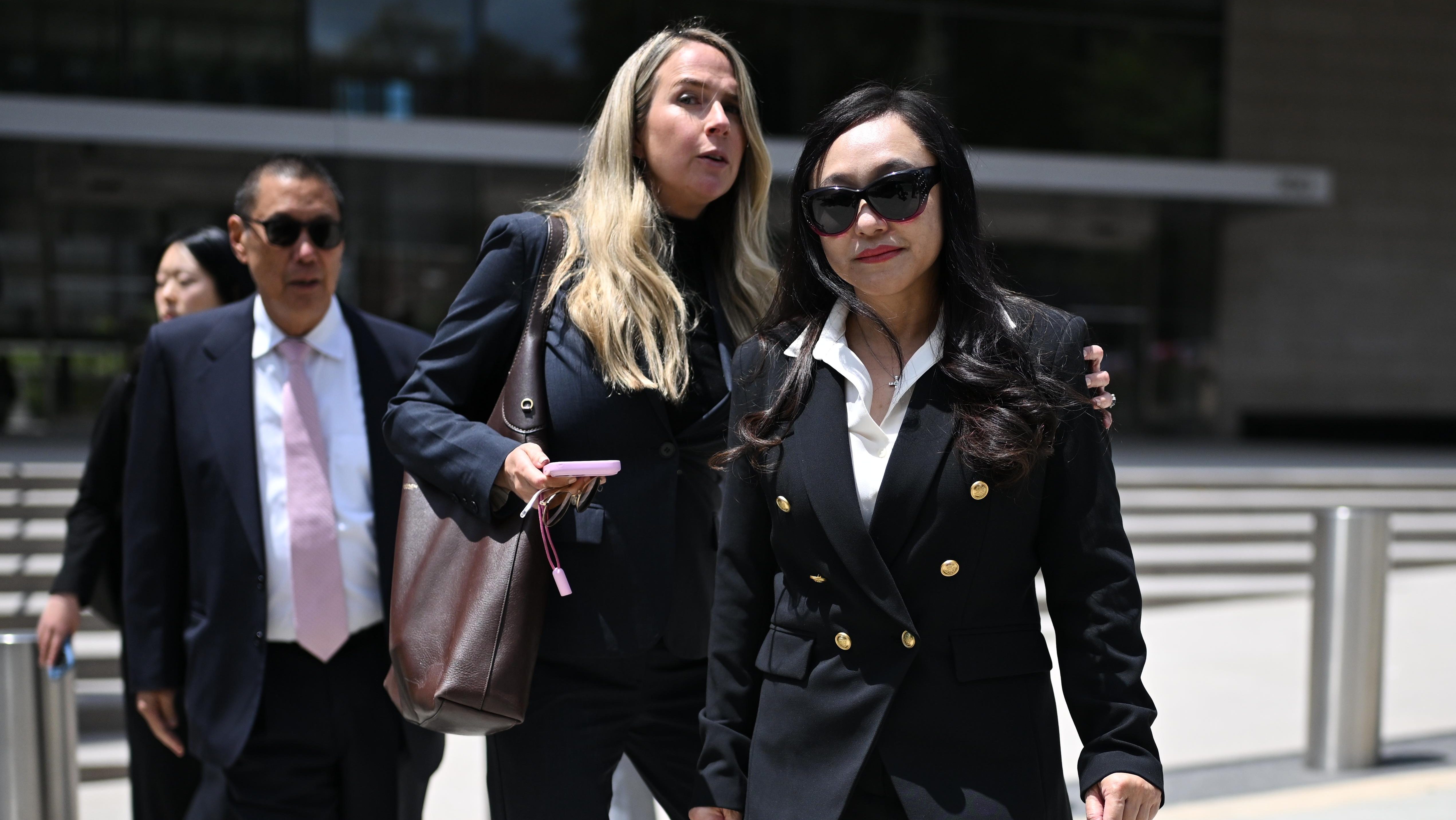 Eileen Wang, the former mayor of Arcadia,  at right, exits federal court after pleading guilty on charges of acting as an illegal agent for the Chinese government on Friday, May 29, 2026, in Los Angeles. (AP Photo/William Liang)
