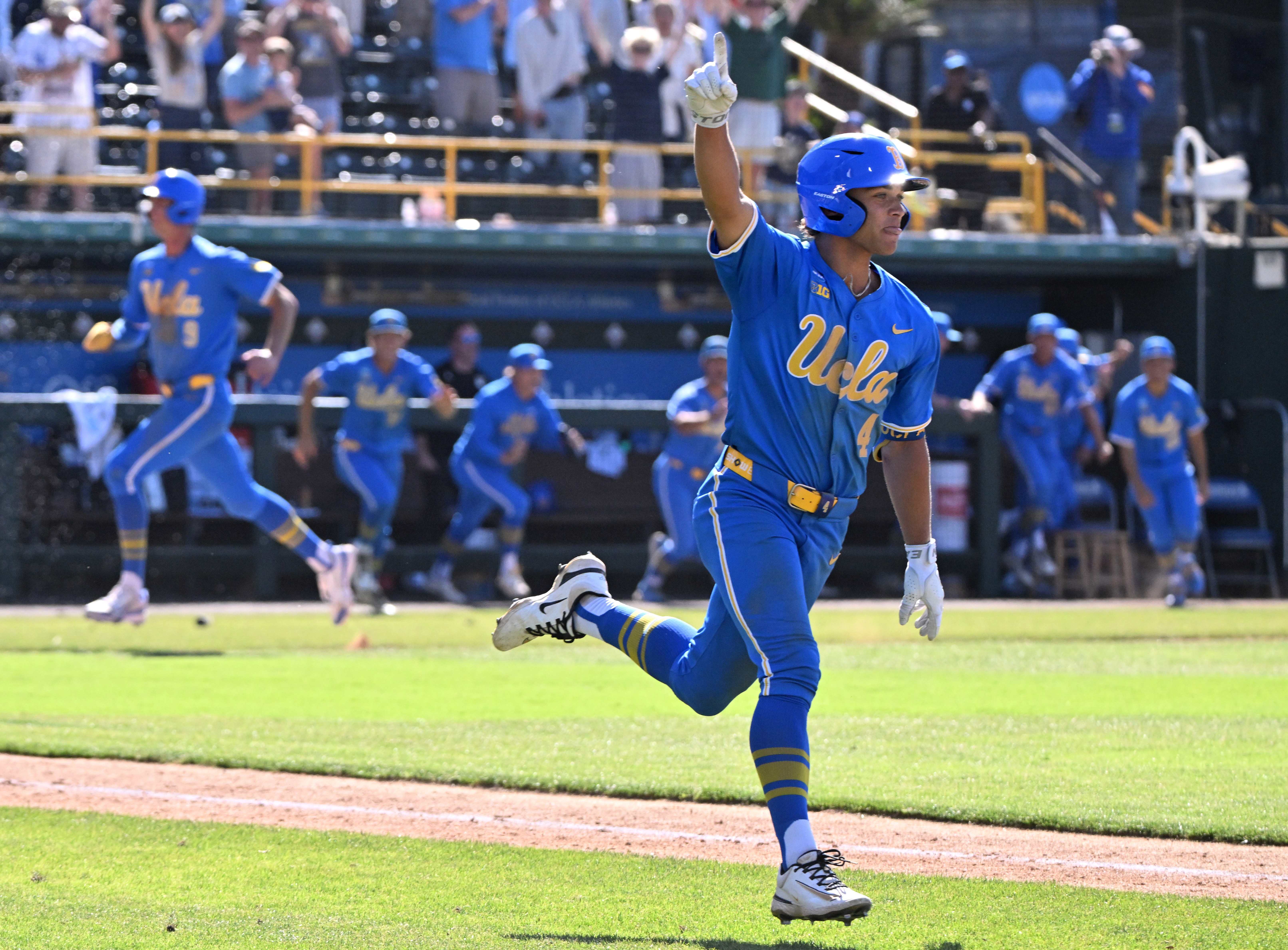 Phoenix Call #4 of the UCLA Bruins reacts after hitting...