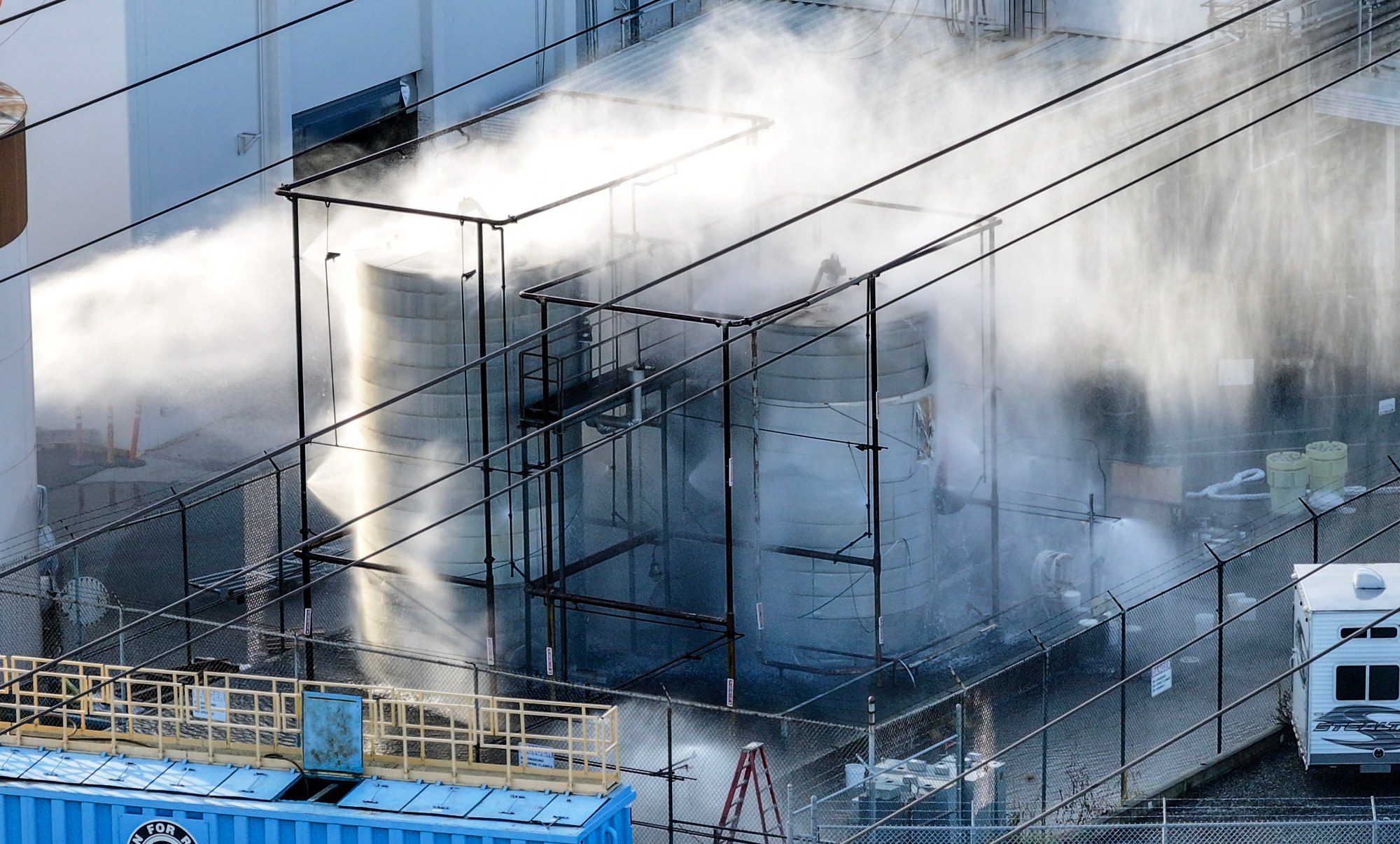A pressurized tank filled with methyl methacrylate is sprayed with water at GKN Aerospace in Garden Grove, CA, on Saturday, May 23, 2026. (Photo by Jeff Gritchen, Orange County Register/SCNG)
