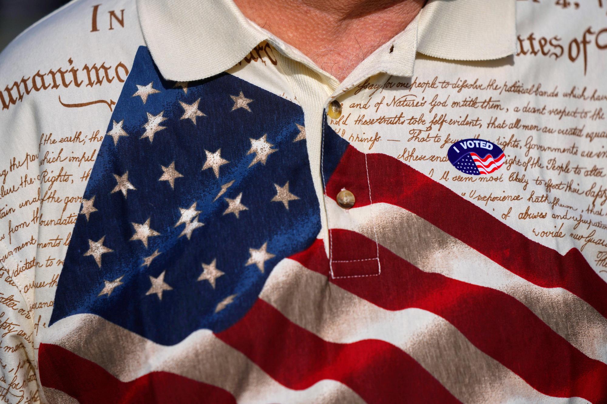FILE – A man wears an “I voted” sticker on his shirt, printed with the American flag and the U.S. constitution, after voting at Wa-Ke Hatchee Recreation Center in Fort Myers, Fla, on Election Day, Nov. 8, 2022. (AP Photo/Rebecca Blackwell, File)
