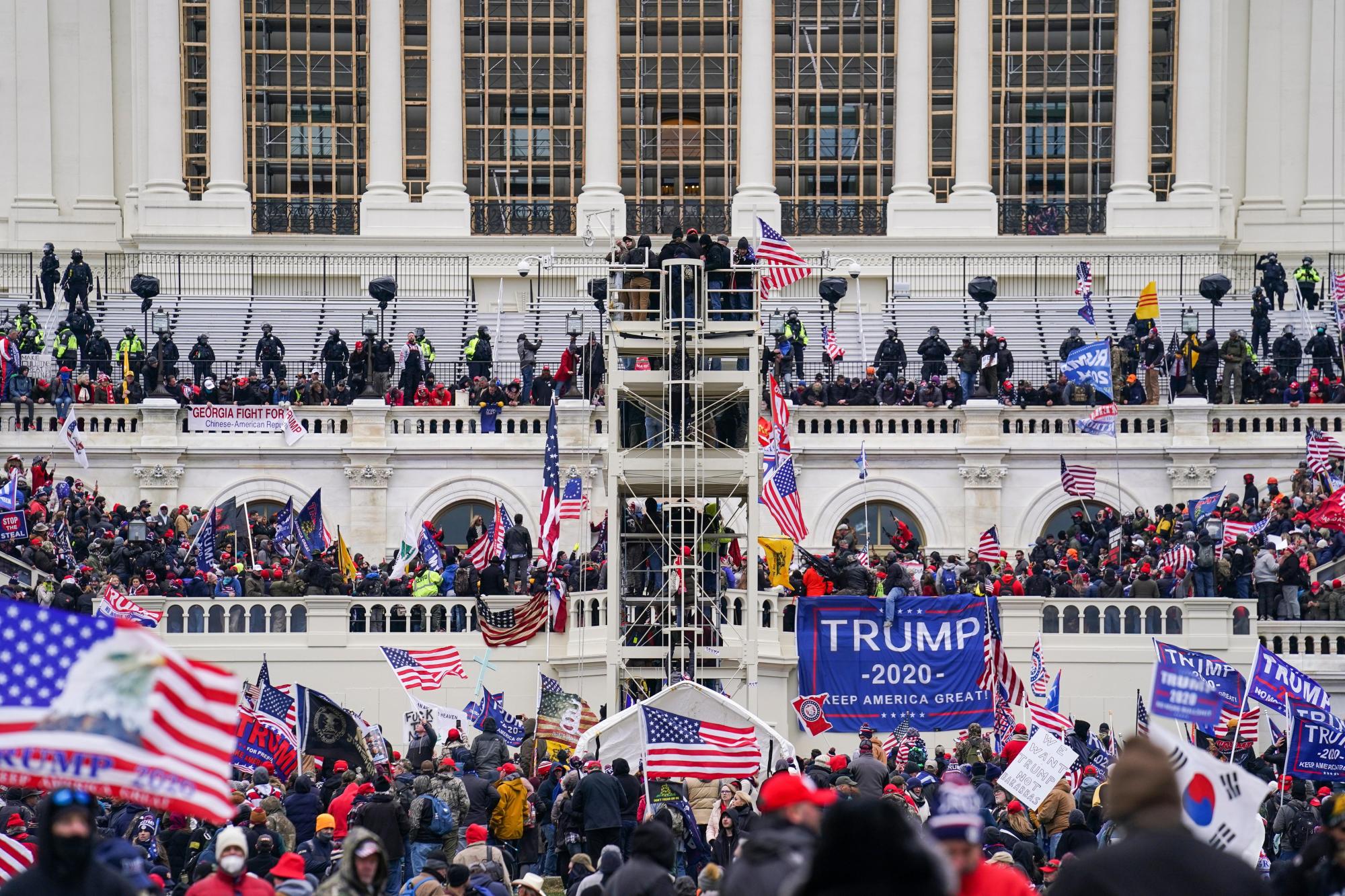 FILE – Insurrectionists loyal to President Donald Trump breach the Capitol in Washington, Jan. 6, 2021. (AP Photo/John Minchillo, File)
